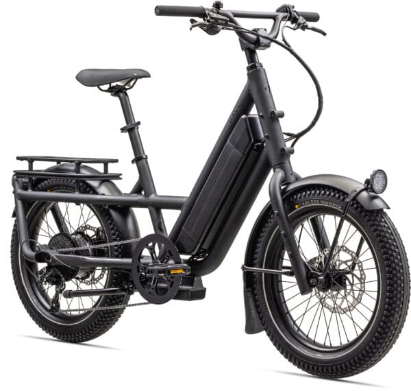 A black electric bike is parked on the ground.